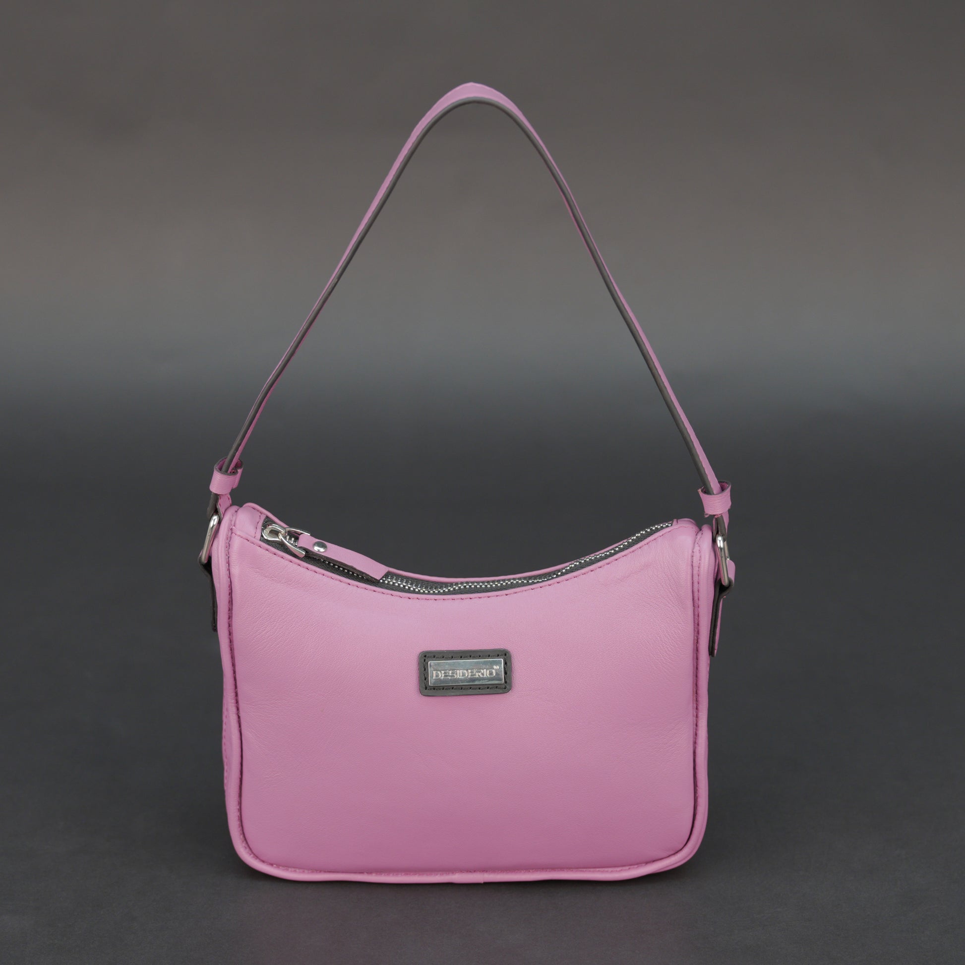 Pink sheep leather bag with zip closure and inner pocket.