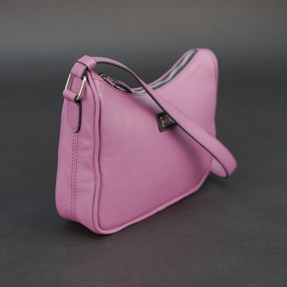 Pink sheep leather bag with zip closure and inner pocket.