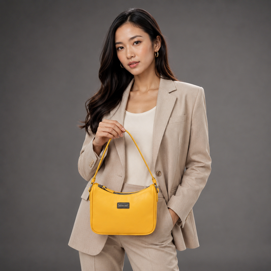 Yellow sheep leather bag with zip closure and inner pocket.