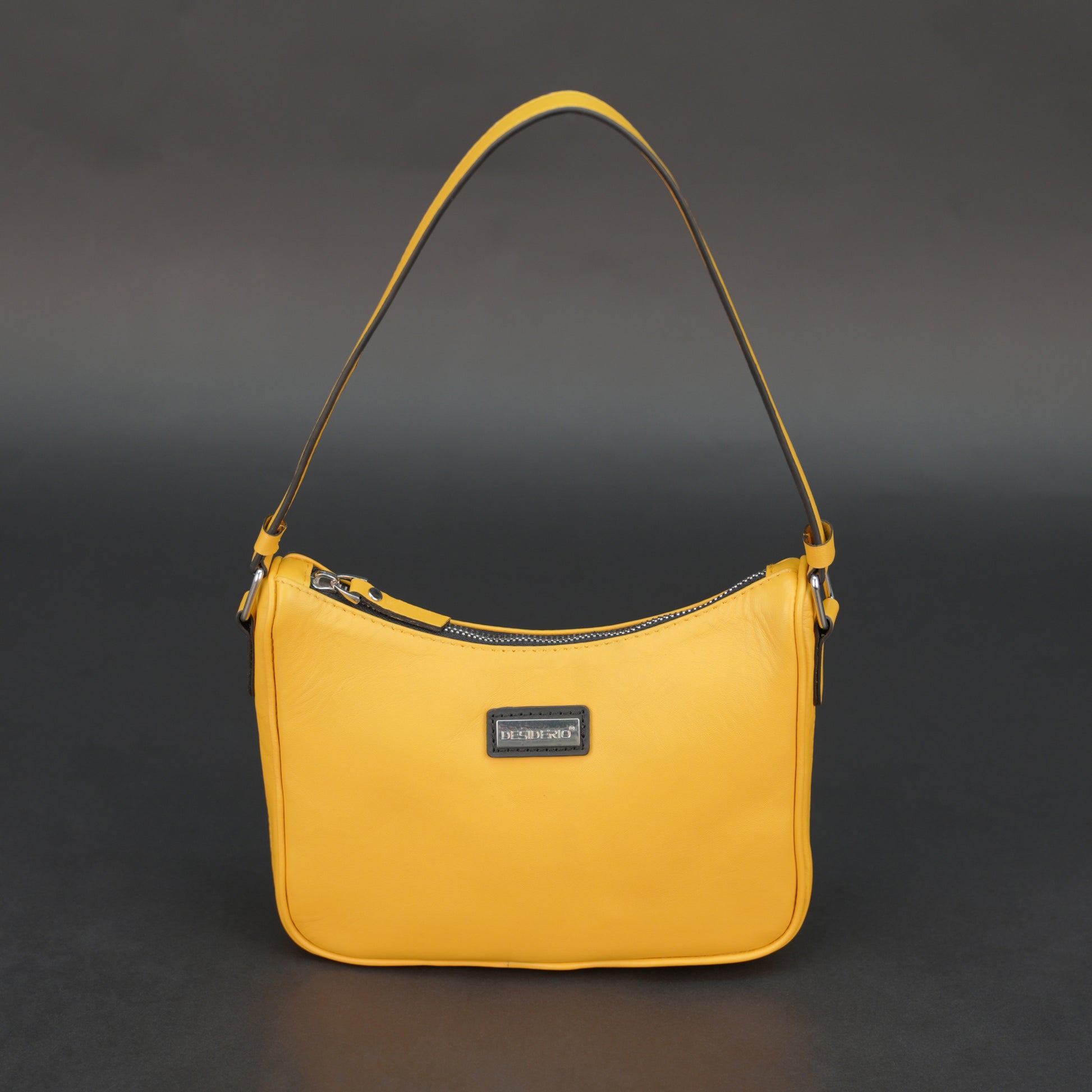 Yellow sheep leather bag with zip closure and inner pocket.