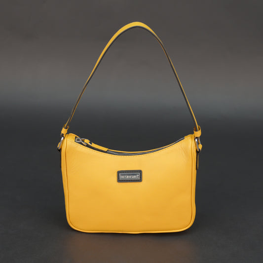 Yellow sheep leather bag with zip closure and inner pocket.
