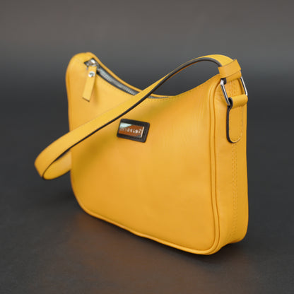 Yellow sheep leather bag with zip closure and inner pocket.