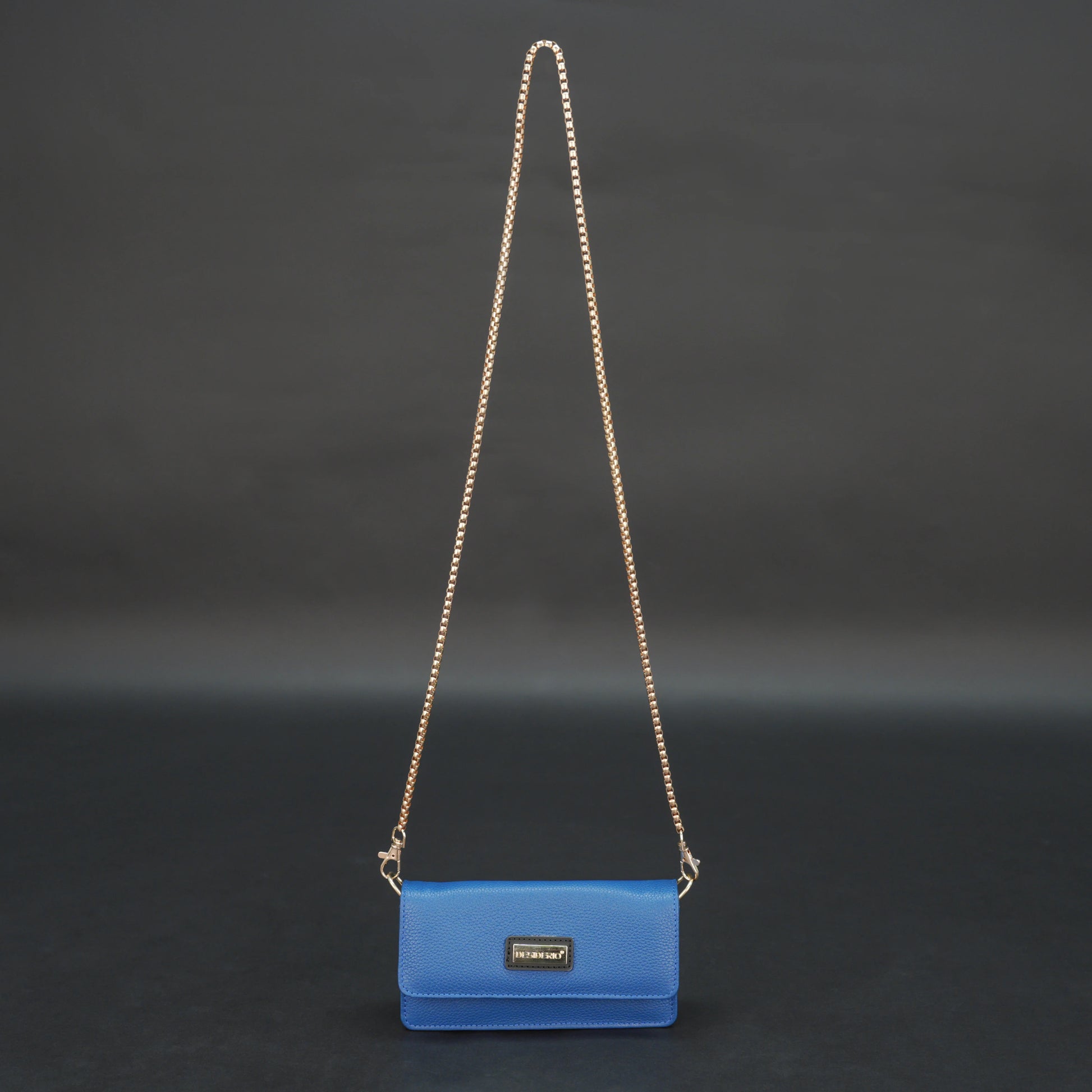 Blue cow PDM leather bag with chain strap, main compartment, and inner pocket.