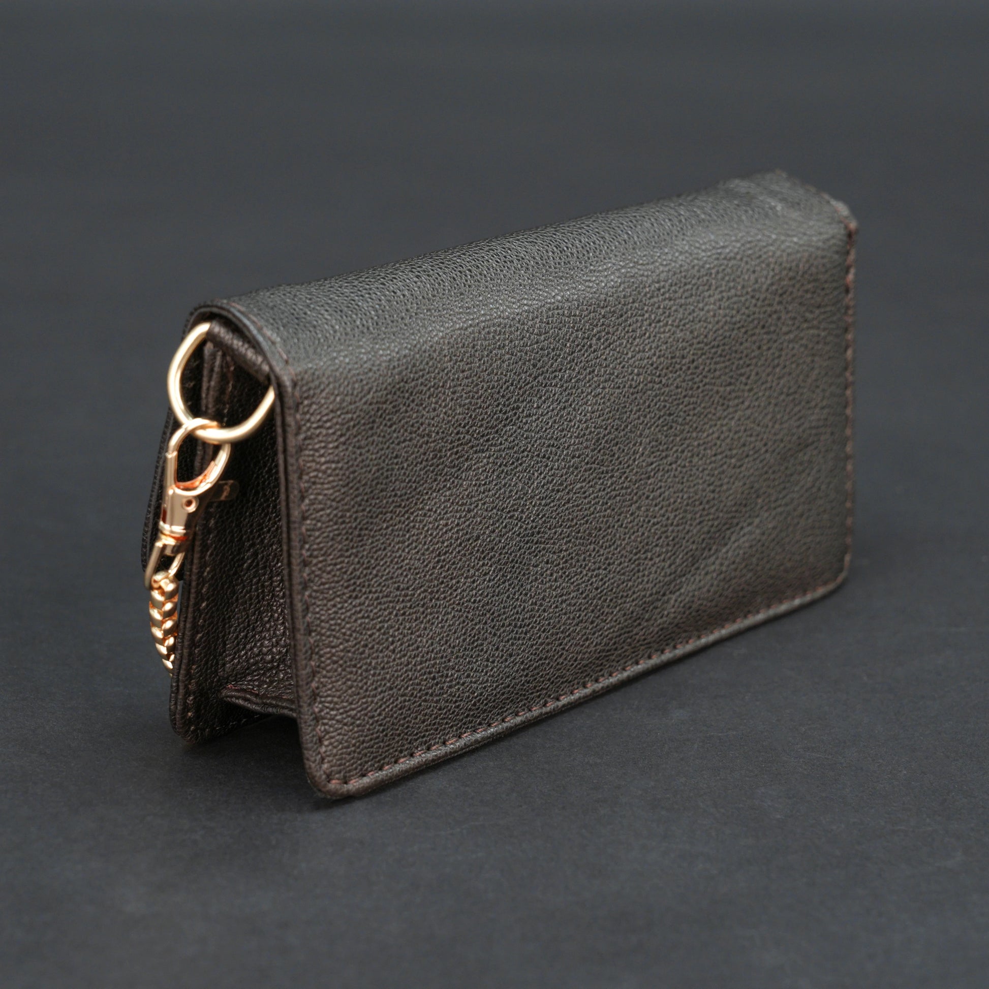 Dark brown goat leather bag with chain strap, main compartment, and inner pocket.