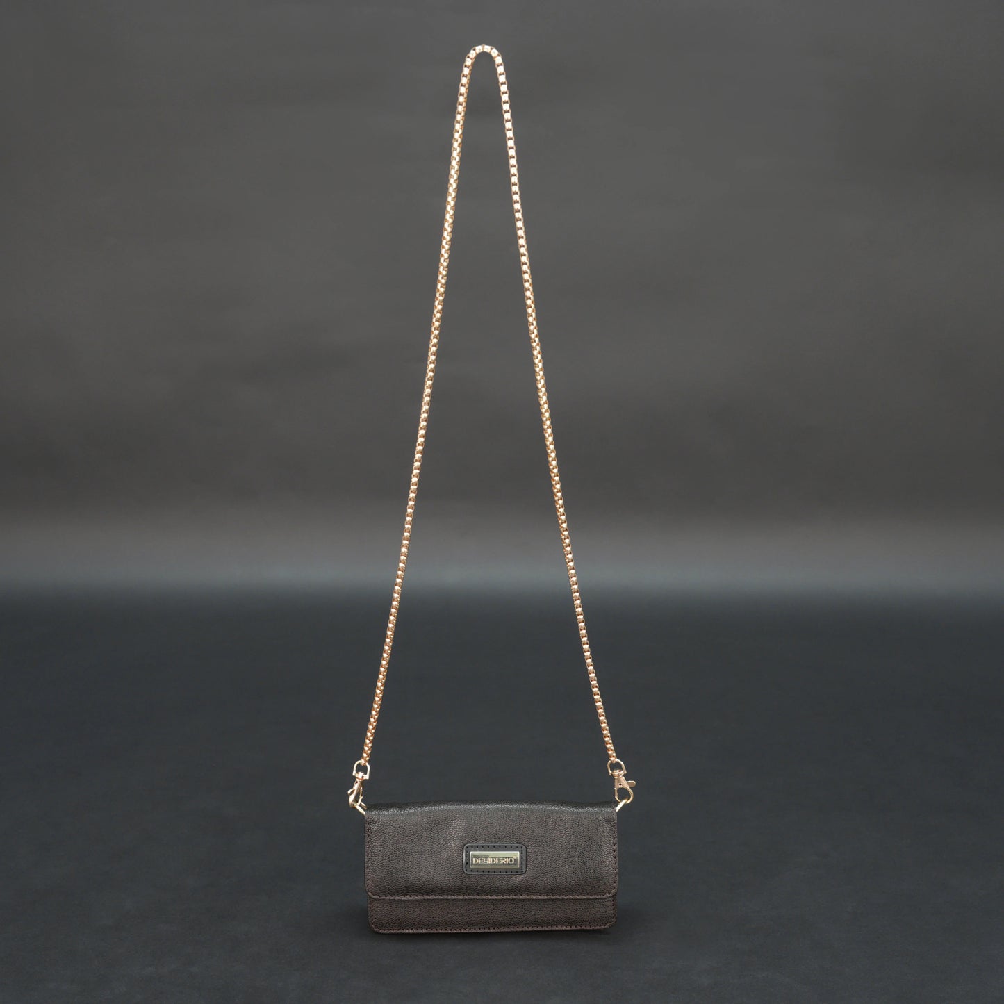Dark brown goat leather bag with chain strap, main compartment, and inner pocket.