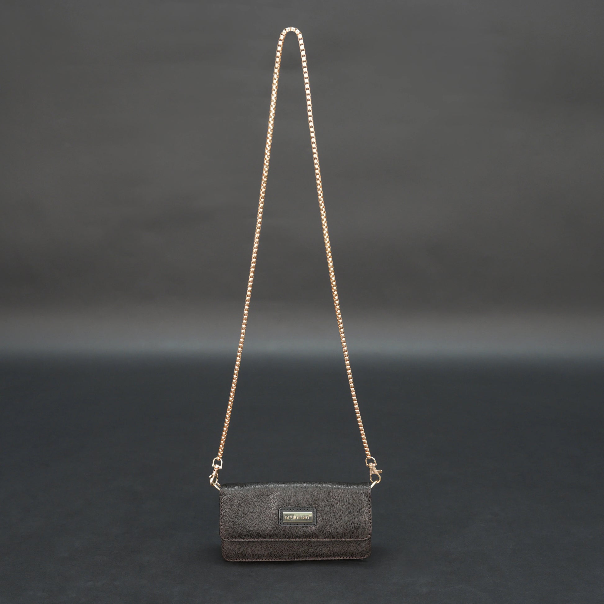 Dark brown goat leather bag with chain strap, main compartment, and inner pocket.