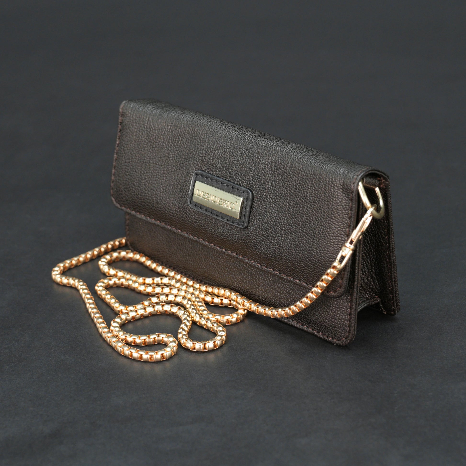 Dark brown goat leather bag with chain strap, main compartment, and inner pocket.