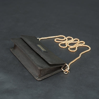 Dark brown goat leather bag with chain strap, main compartment, and inner pocket.