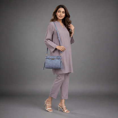 Light blue cow leather bag with shoulder strap, main compartment, and inner pockets.