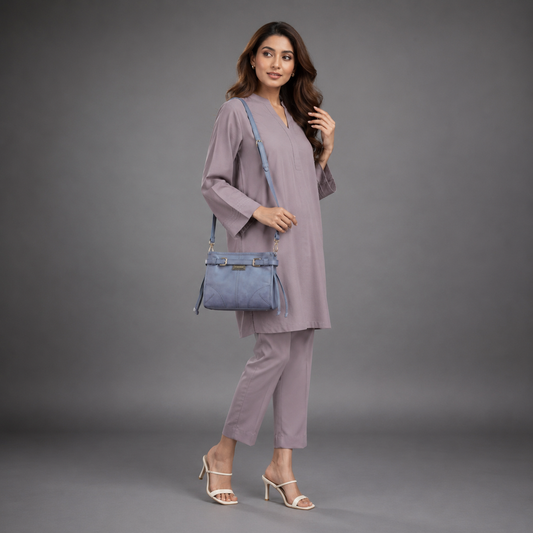Light blue cow leather bag with shoulder strap, main compartment, and inner pockets.