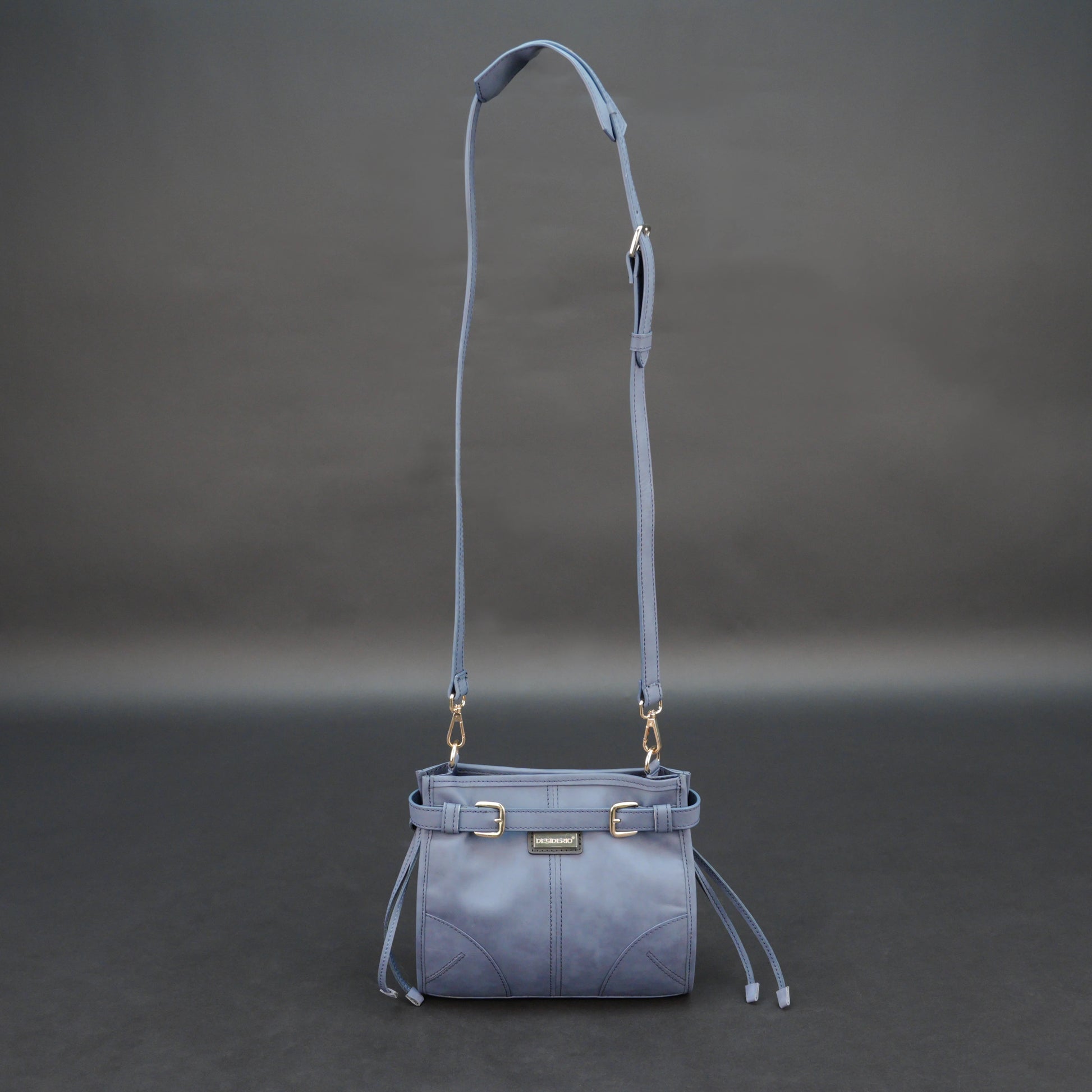Light blue cow leather bag with shoulder strap, main compartment, and inner pockets.