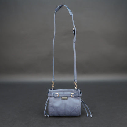 Light blue cow leather bag with shoulder strap, main compartment, and inner pockets.