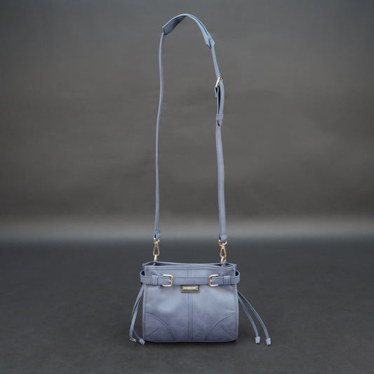 Light blue cow leather bag with shoulder strap, main compartment, and inner pockets.