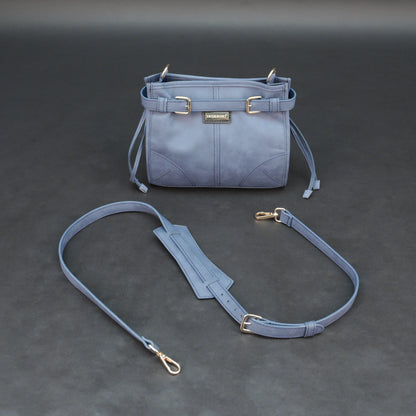 Light blue cow leather bag with shoulder strap, main compartment, and inner pockets.