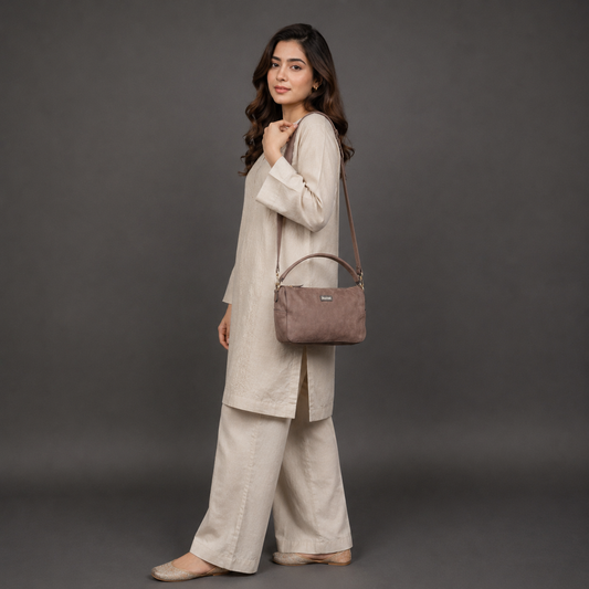 Choco cow Chelsea leather bag with zip compartments and pockets.