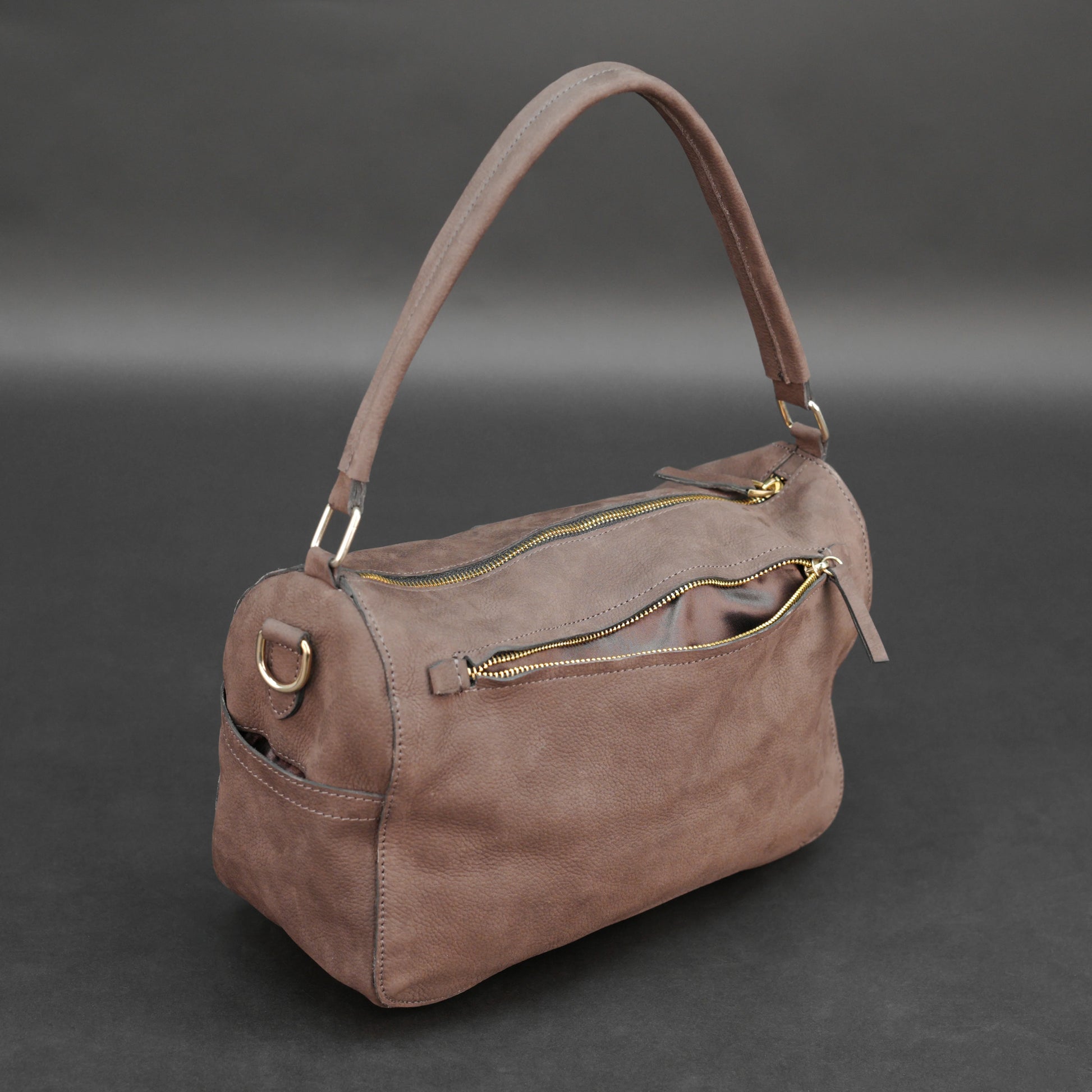 Choco cow Chelsea leather bag with zip compartments and pockets.