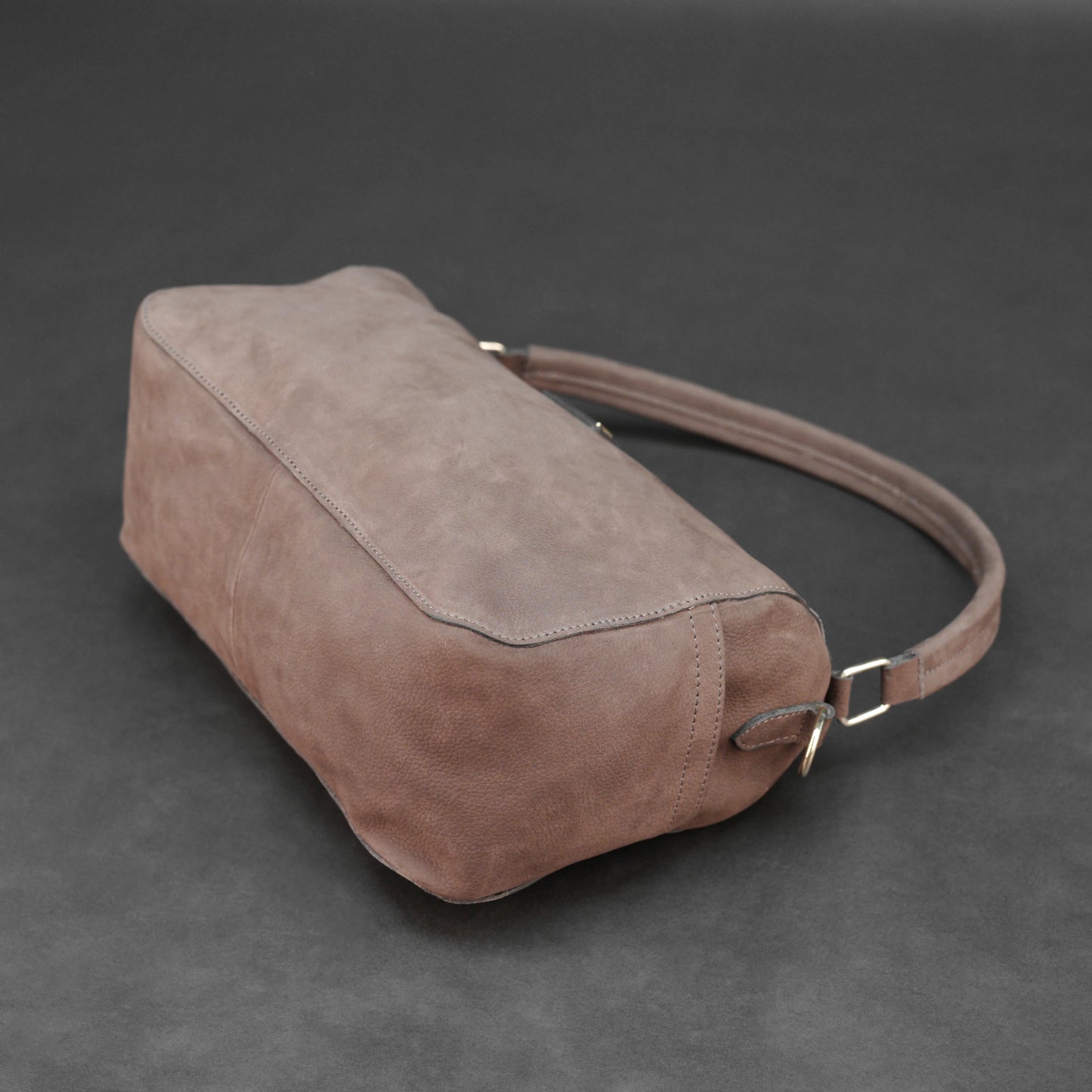 Choco cow Chelsea leather bag with zip compartments and pockets.
