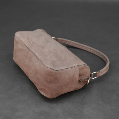 Choco cow Chelsea leather bag with zip compartments and pockets.
