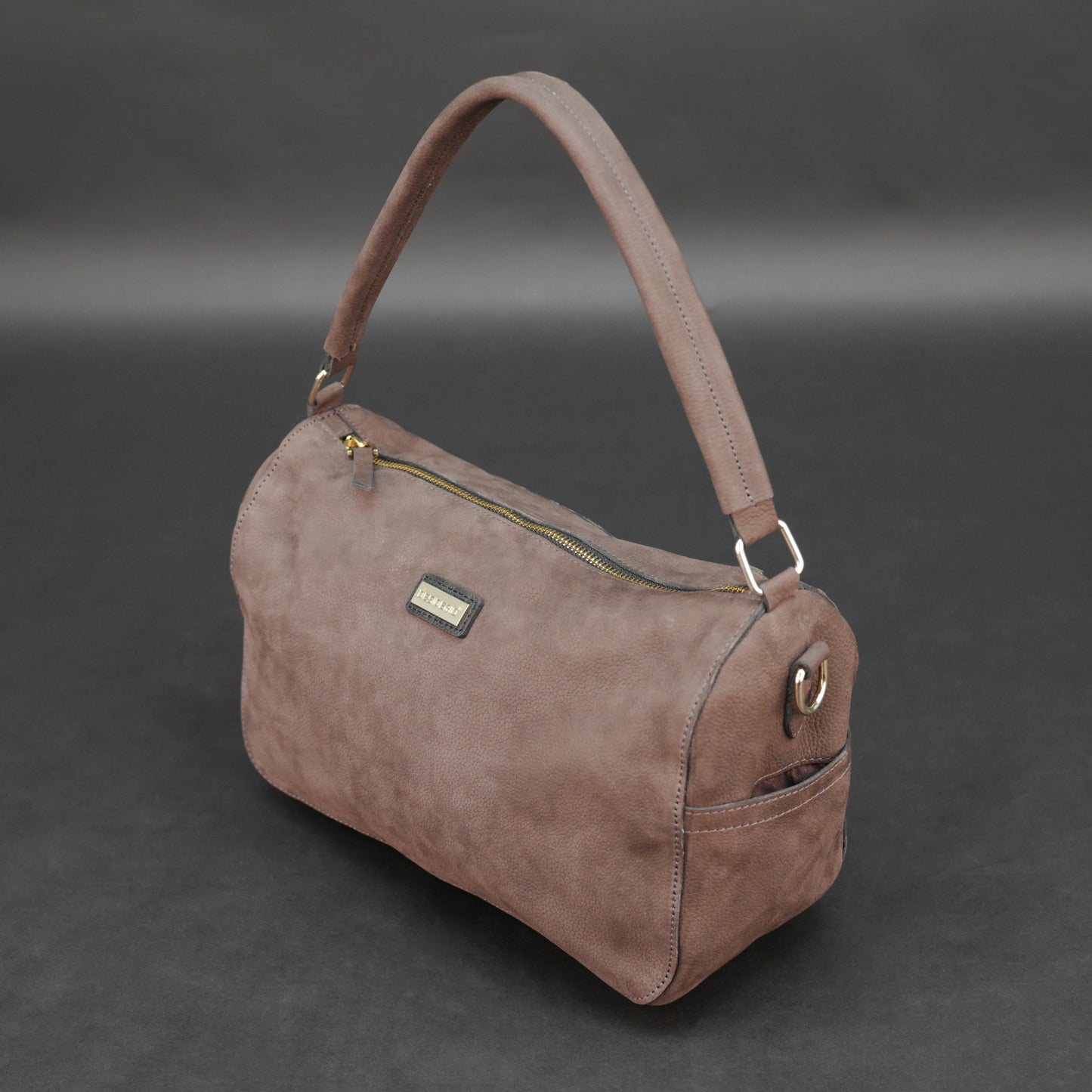 Choco cow Chelsea leather bag with zip compartments and pockets.