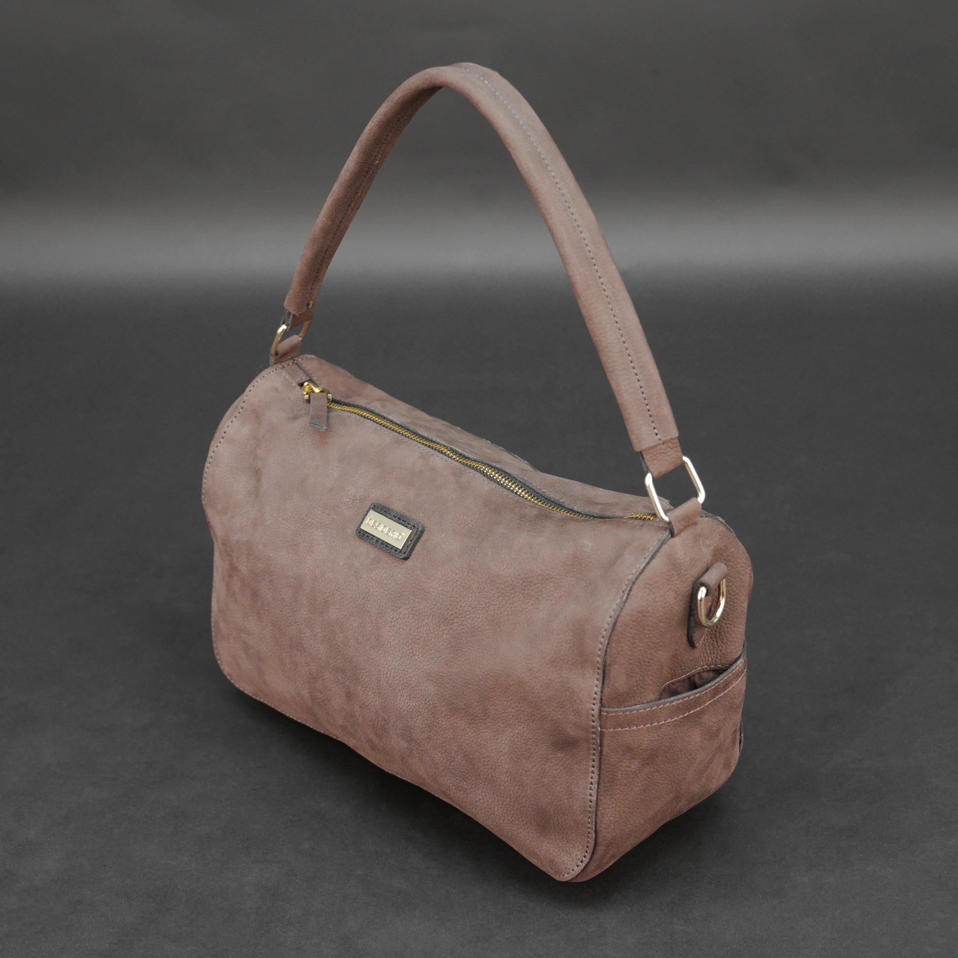 Choco cow Chelsea leather bag with zip compartments and pockets.