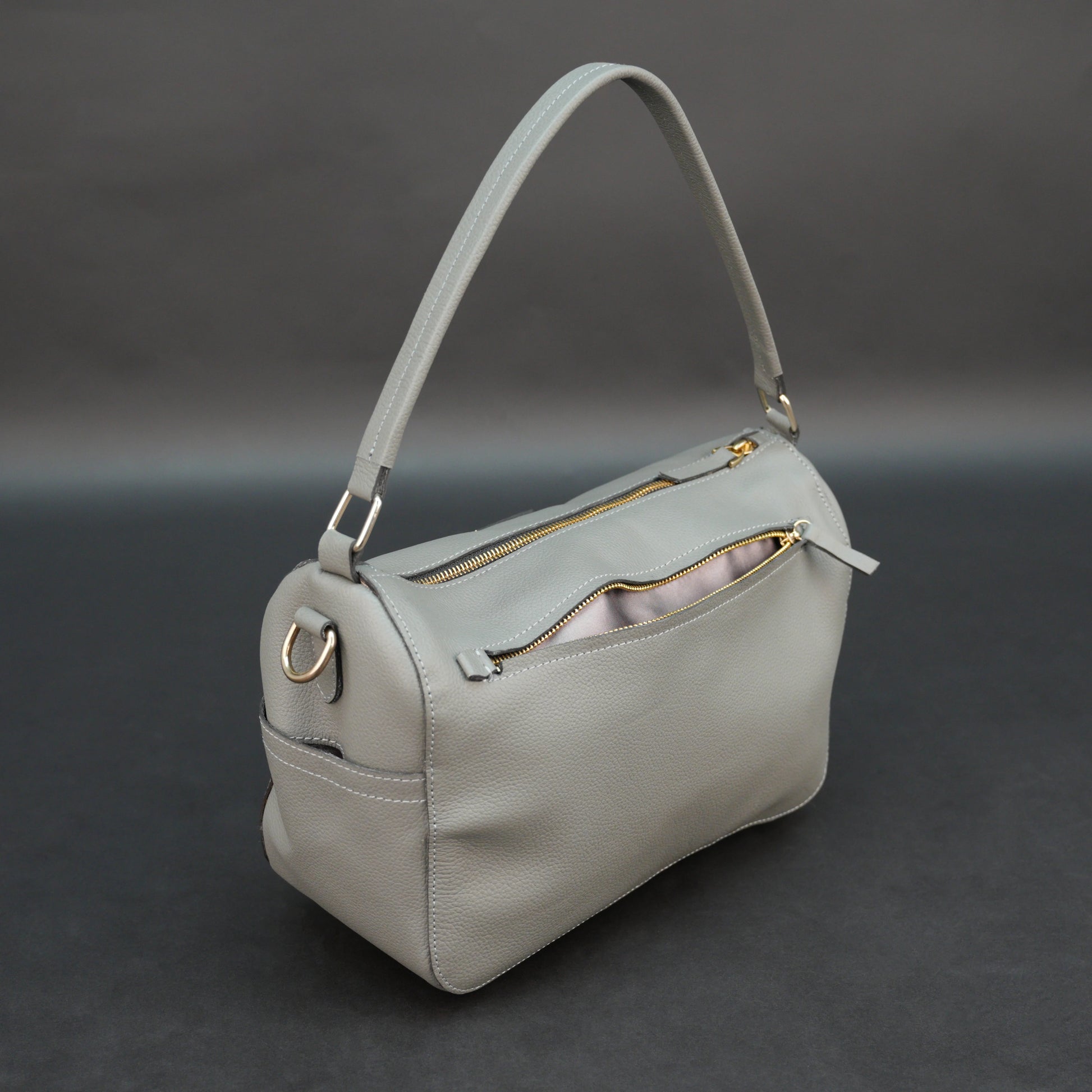 Silver cow Chelsea leather bag with zip closure, multiple pockets, and durable everyday design.