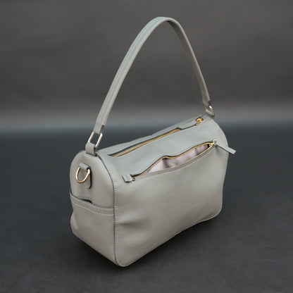 Silver cow Chelsea leather bag with zip closure, multiple pockets, and durable everyday design.