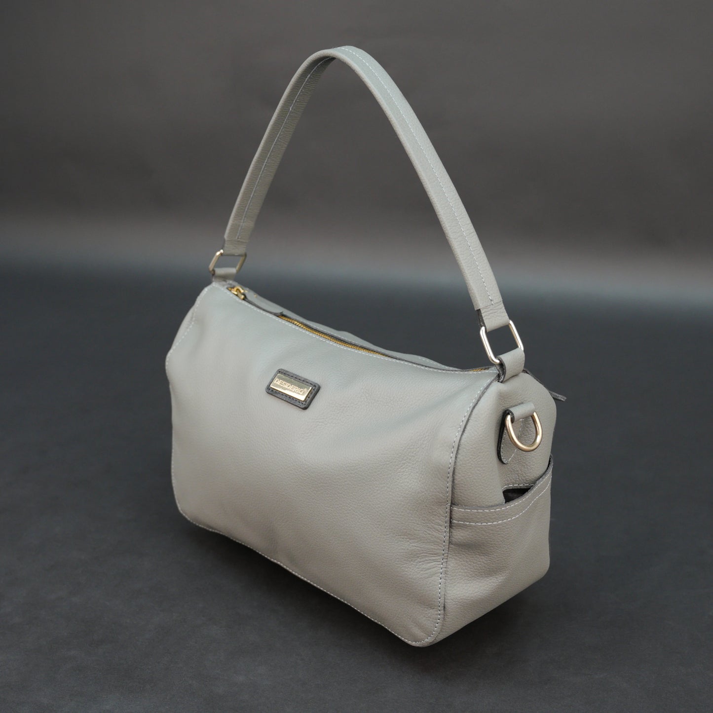 Silver cow Chelsea leather bag with zip closure, multiple pockets, and durable everyday design.