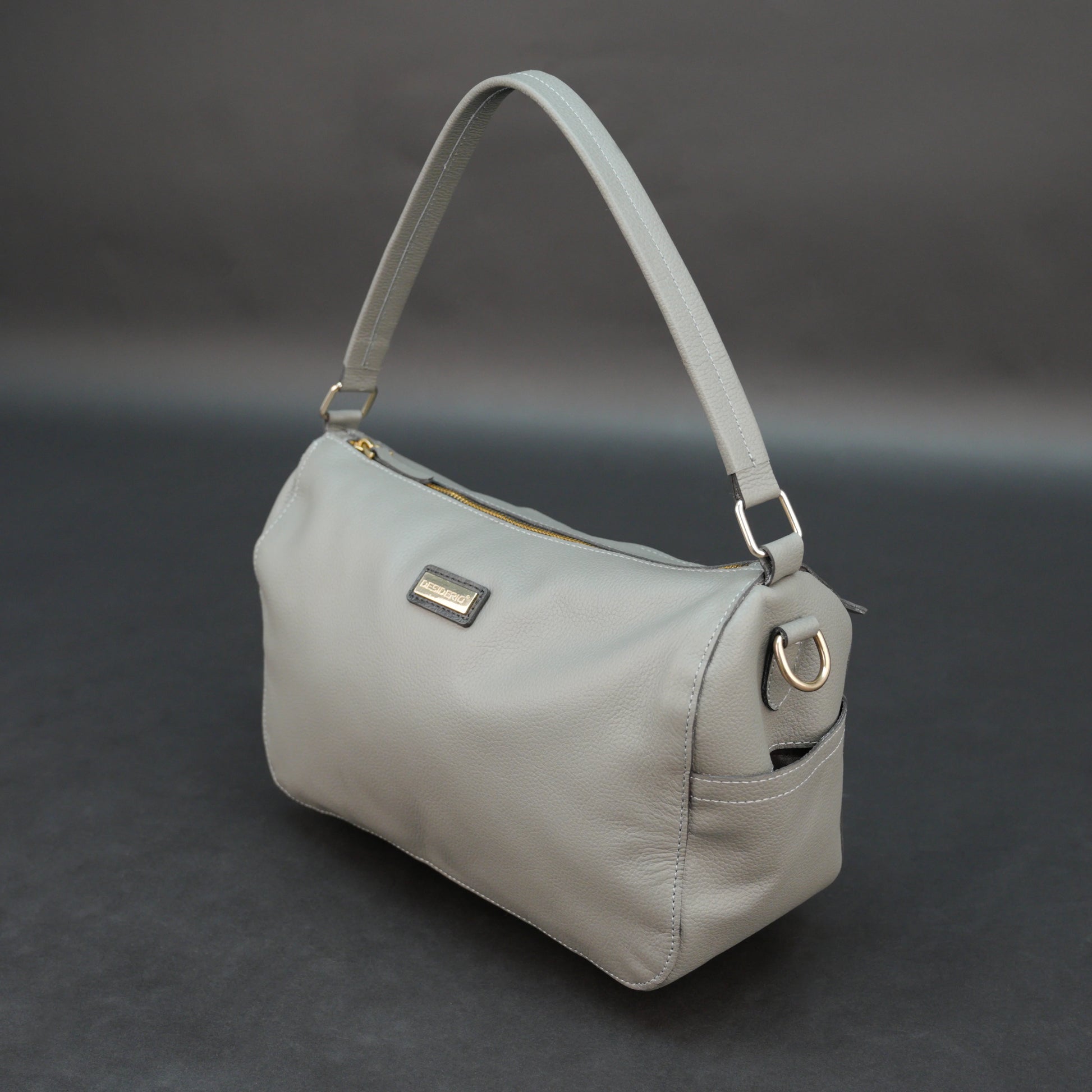 Silver cow Chelsea leather bag with zip closure, multiple pockets, and durable everyday design.
