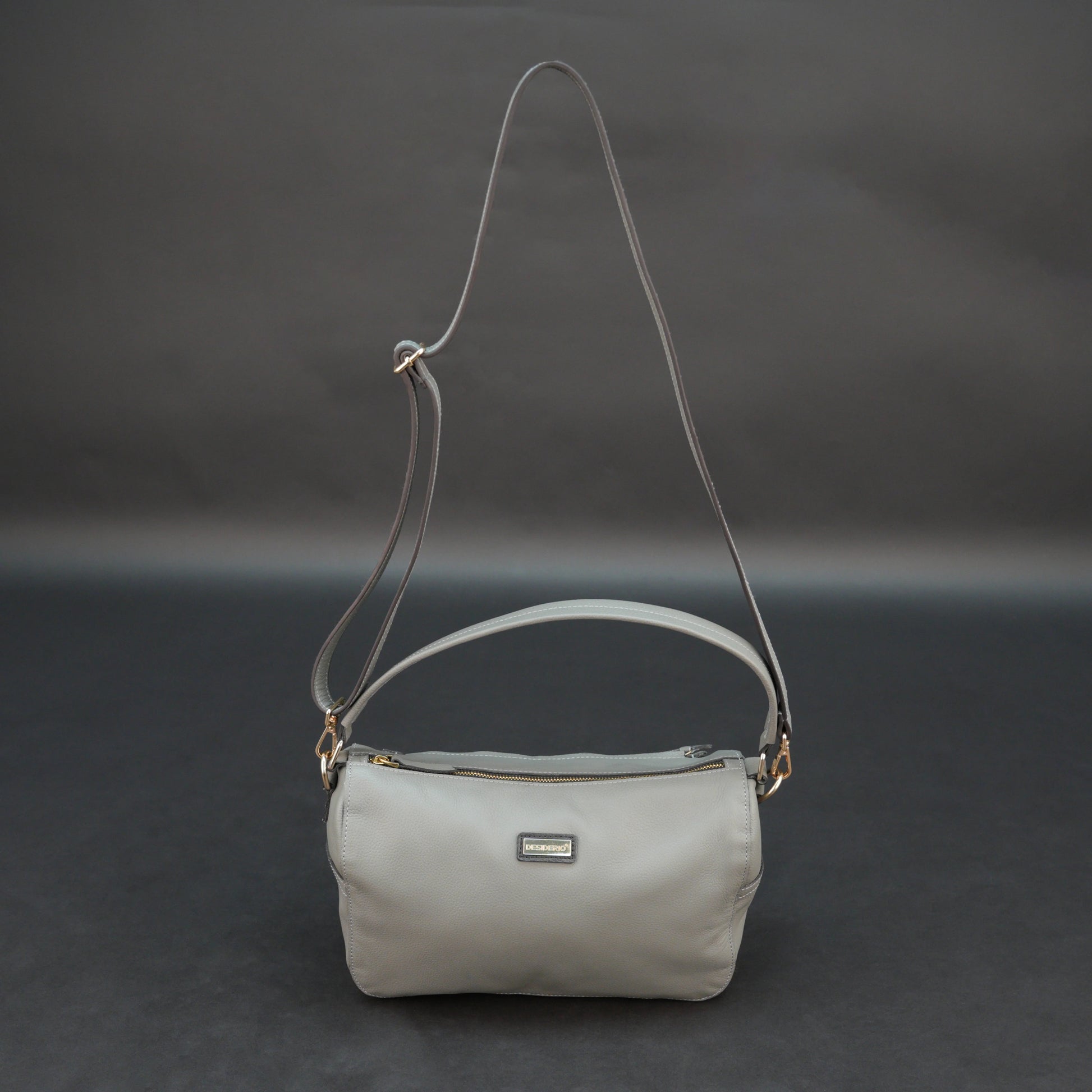 Silver cow Chelsea leather bag with zip closure, multiple pockets, and durable everyday design.