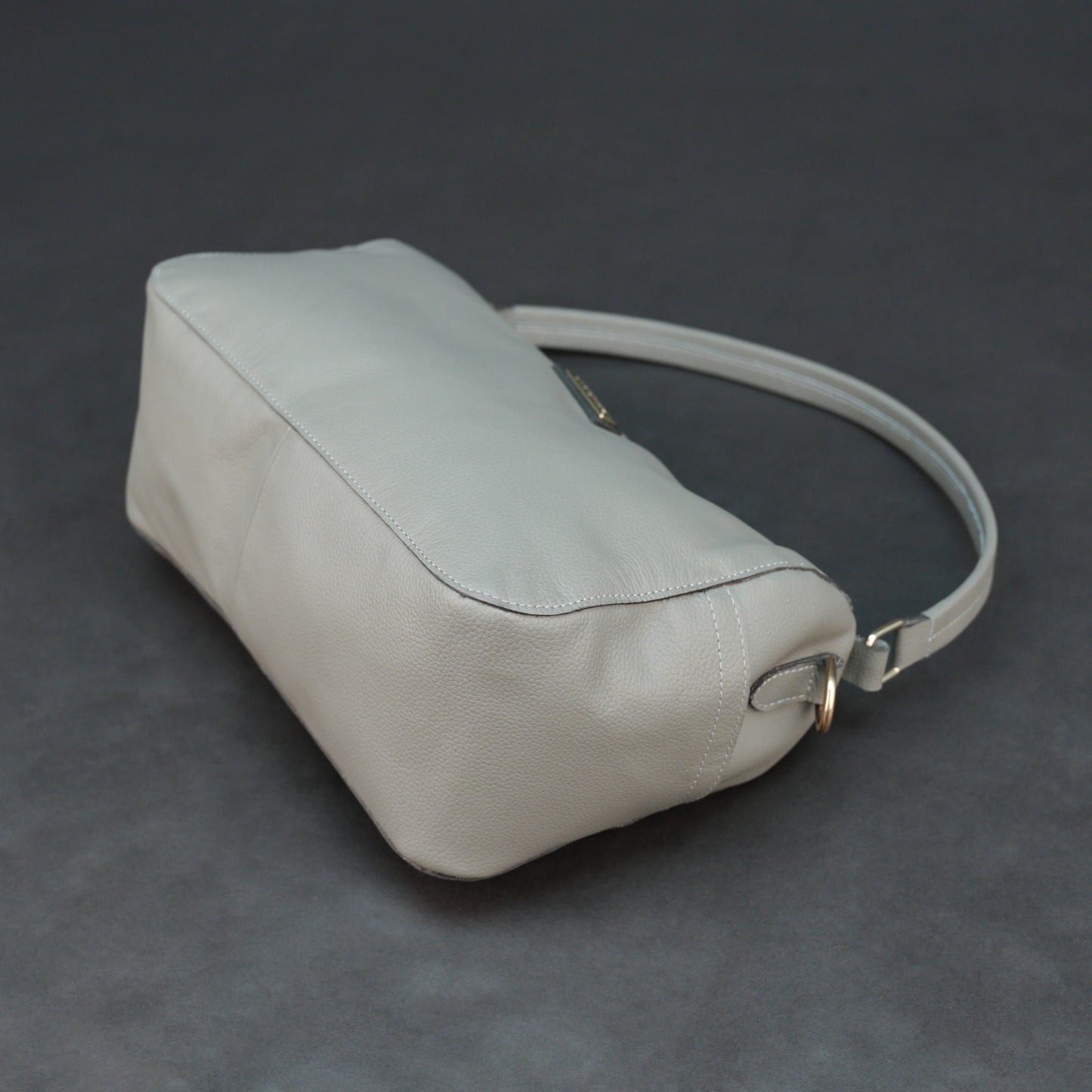 Silver cow Chelsea leather bag with zip closure, multiple pockets, and durable everyday design.