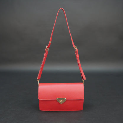 Red sheep leather bag with chain strap, two compartments, and zipper pocket.