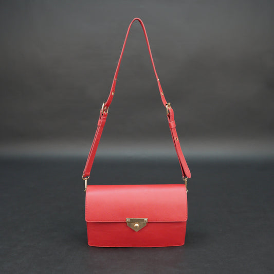 Red sheep leather bag with chain strap, two compartments, and zipper pocket.