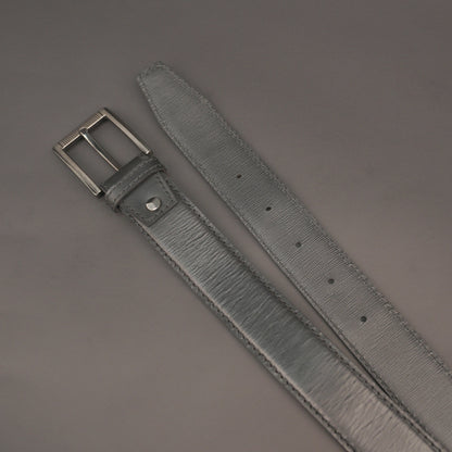Premium leather belt with solid one-piece construction, charcoal metal buckle, durable, adjustable, stylish for jeans and dress wear