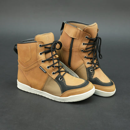 Tan and black motorbike boots with mesh panels and white sole.