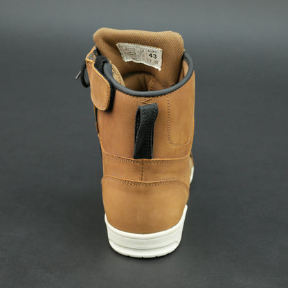 Tan and black motorbike boots with mesh panels and white sole.