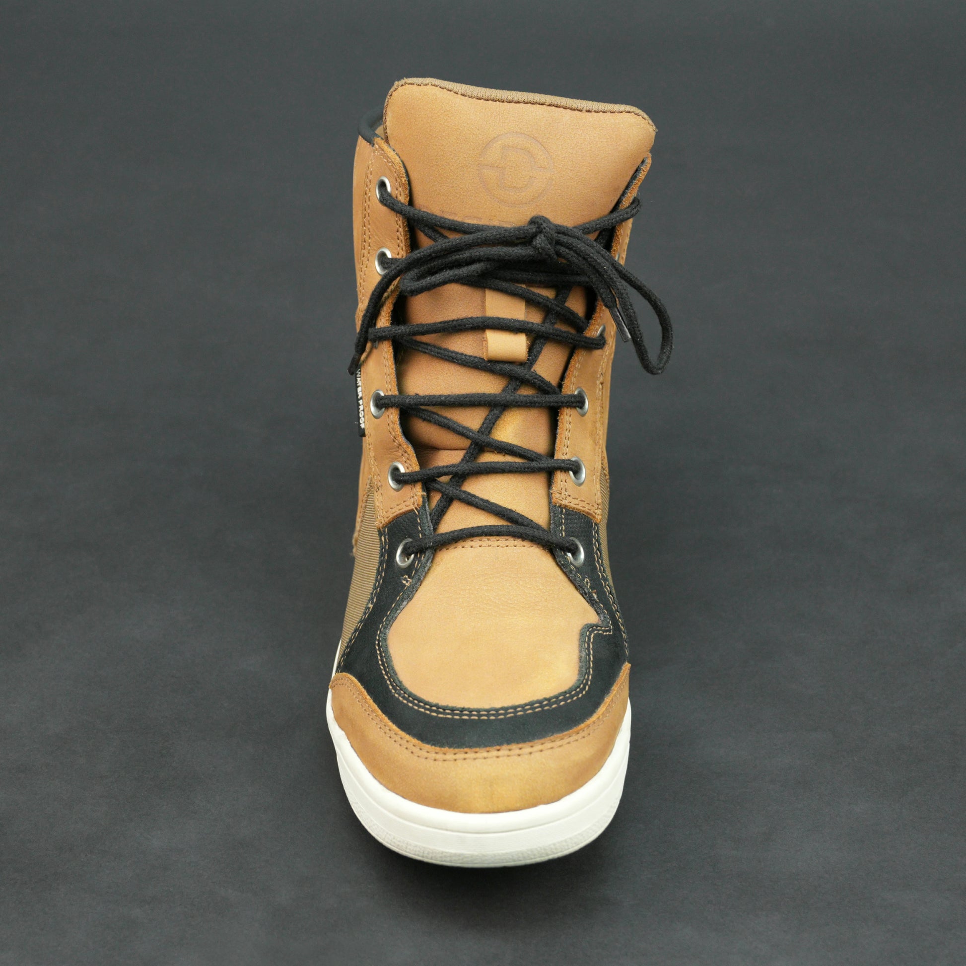 Tan and black motorbike boots with mesh panels and white sole.