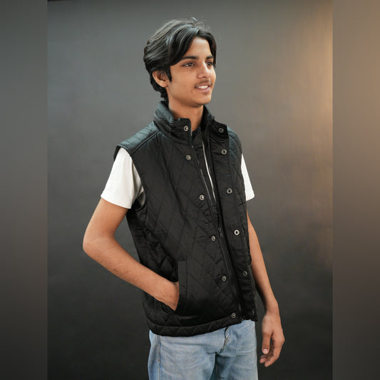 Teen black and maroon puffer vest with zip and snap closure, two side pockets, one inside pocket, warm and stylish for winter