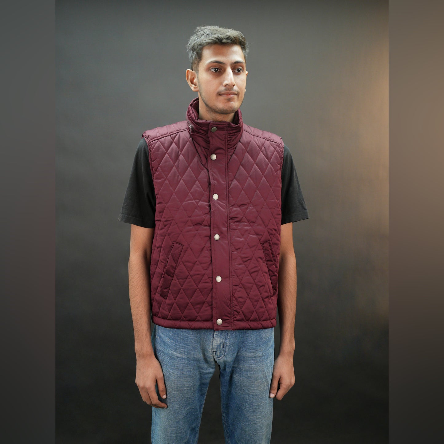 Teen black and maroon puffer vest with zip and snap closure, two side pockets, one inside pocket, warm and stylish for winter
