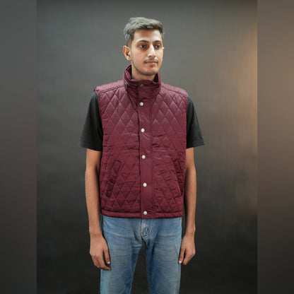 Teen black and maroon puffer vest with zip and snap closure, two side pockets, one inside pocket, warm and stylish for winter