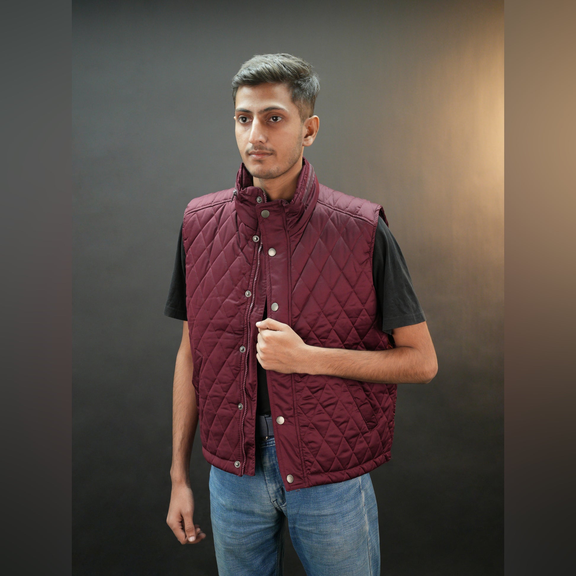 Teen black and maroon puffer vest with zip and snap closure, two side pockets, one inside pocket, warm and stylish for winter
