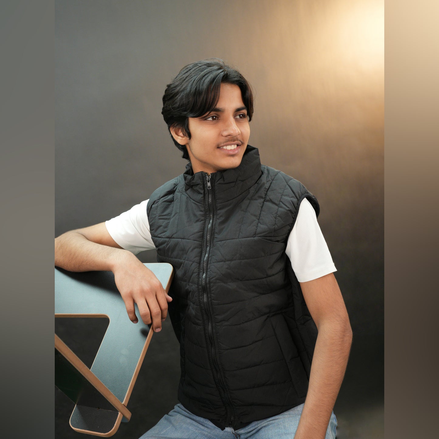 Teen lightweight puffer vest in blue and black with full zip, side snap pockets, and inner pockets—warm and ideal for winter