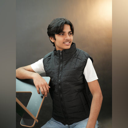 Teen lightweight puffer vest in blue and black with full zip, side snap pockets, and inner pockets—warm and ideal for winter