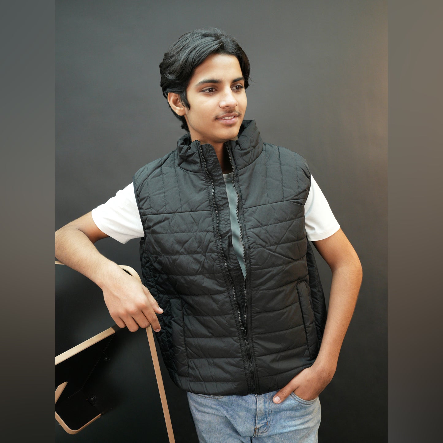 Teen lightweight puffer vest in blue and black with full zip, side snap pockets, and inner pockets—warm and ideal for winter