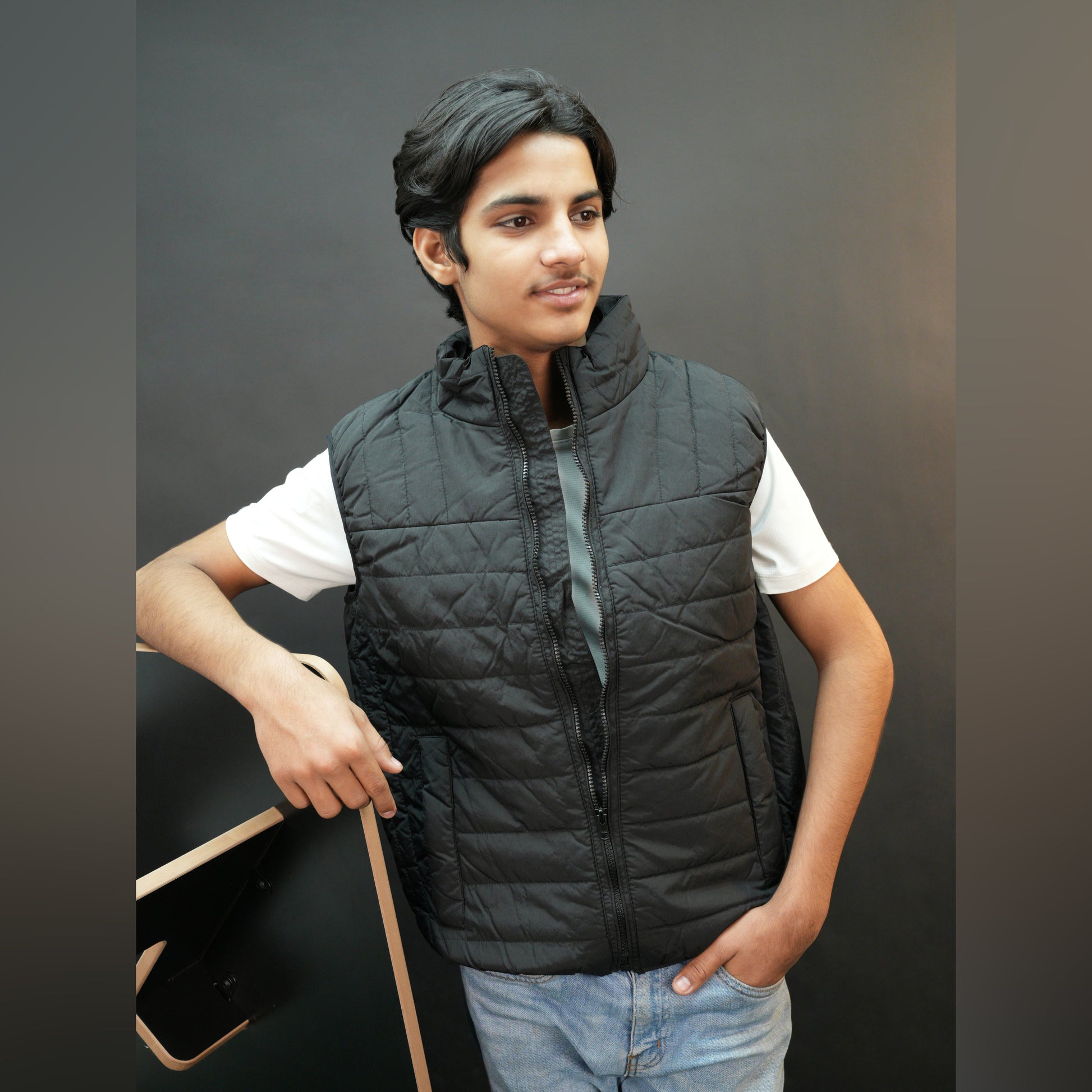 Teen lightweight puffer vest in blue and black with full zip, side snap pockets, and inner pockets—warm and ideal for winter