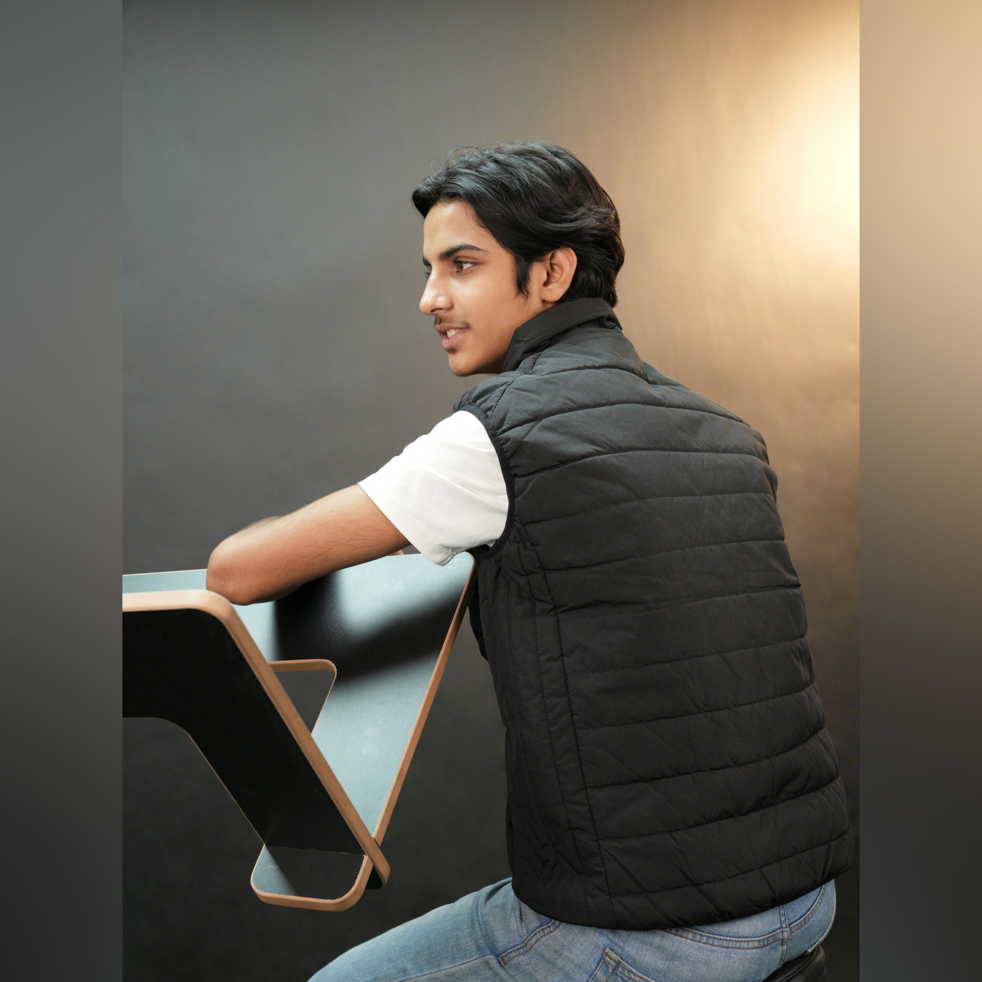 Teen lightweight puffer vest in blue and black with full zip, side snap pockets, and inner pockets—warm and ideal for winter