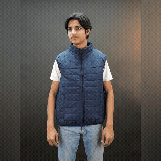 Teen lightweight puffer vest in blue and black with full front zip, two side snap pockets, and two inside pockets, warm and ideal for winter
