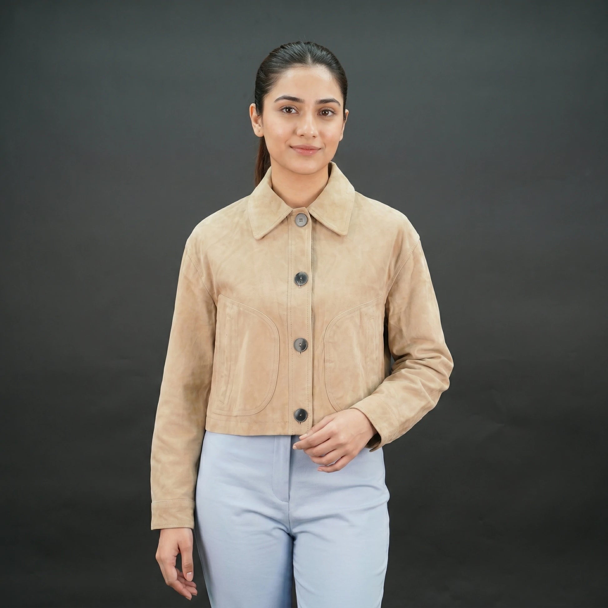 Beige suede cropped jacket with shirt collar, front pockets, and slim fit design.