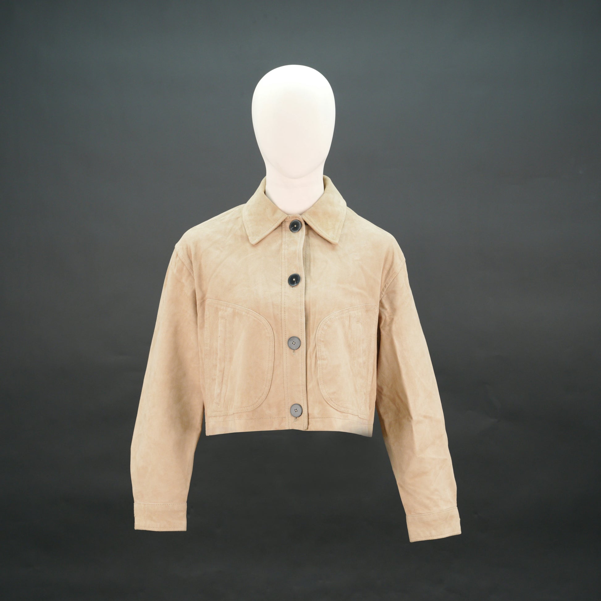 Beige suede cropped jacket with shirt collar, front pockets, and slim fit design.