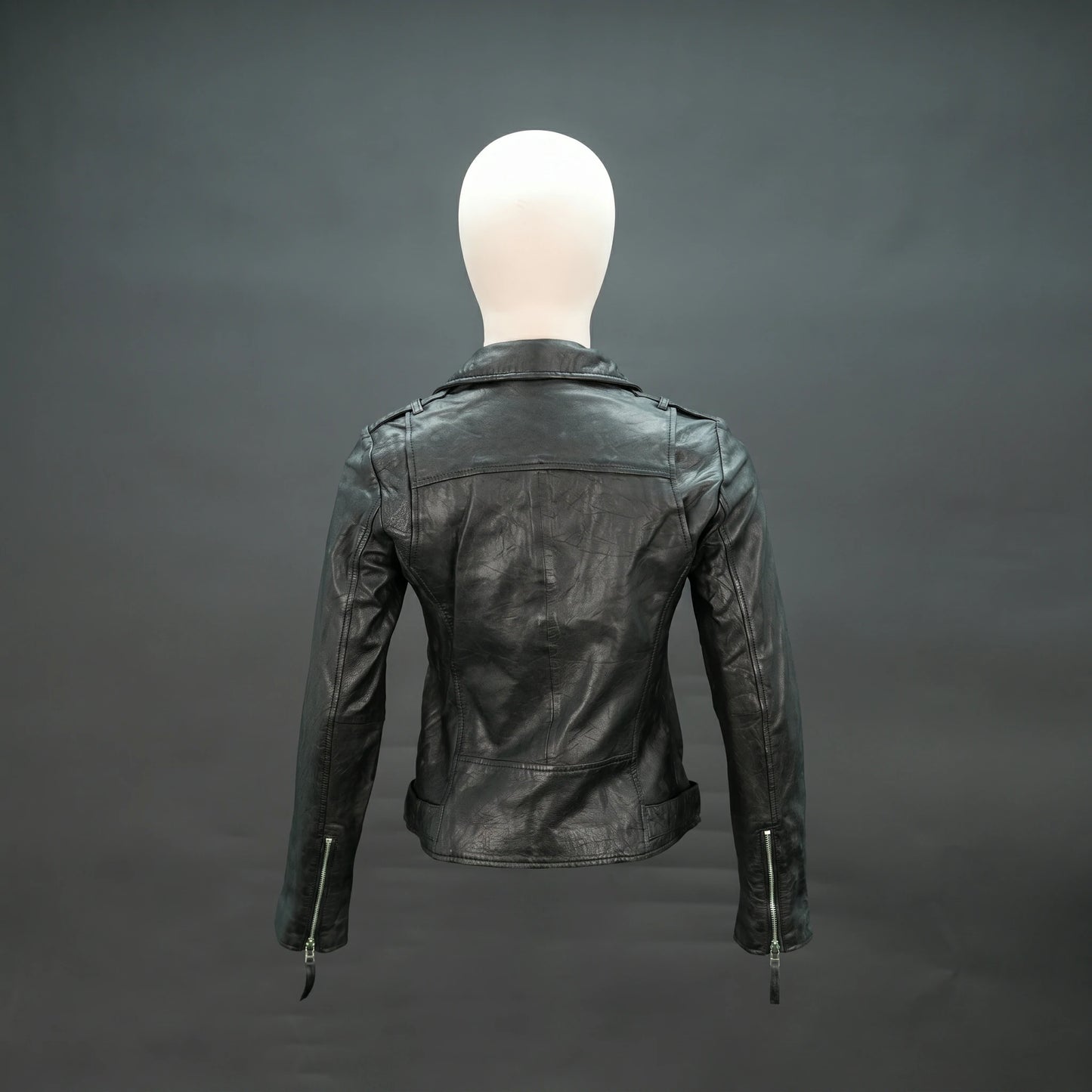 Black lambskin leather biker jacket with asymmetrical zip and lapel collar.