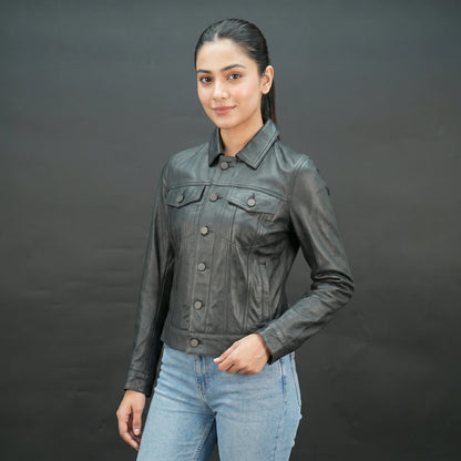 Black cropped leather jacket with shirt collar, flap pockets, and slim fit design.